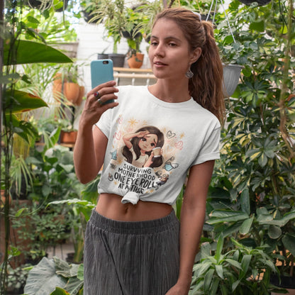 Woman taking a selfie in a greenhouse wearing a white t-shirt with a graphic design.