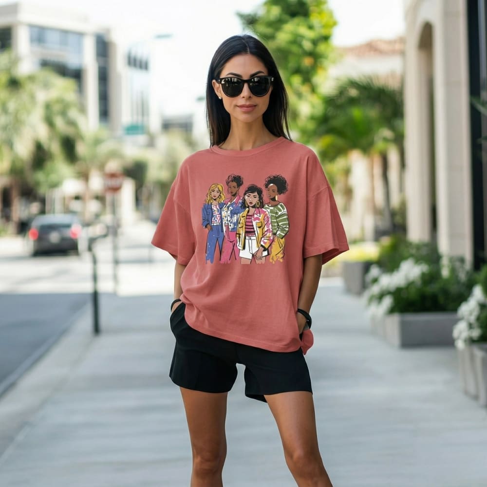 Woman wearing a red t-shirt with graphic design on a city street