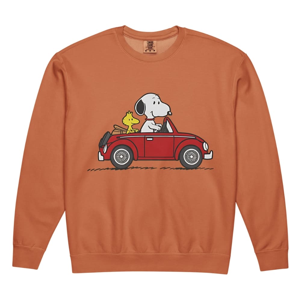 Snoopy and Woodstock in a car on an orange sweatshirt with a white background