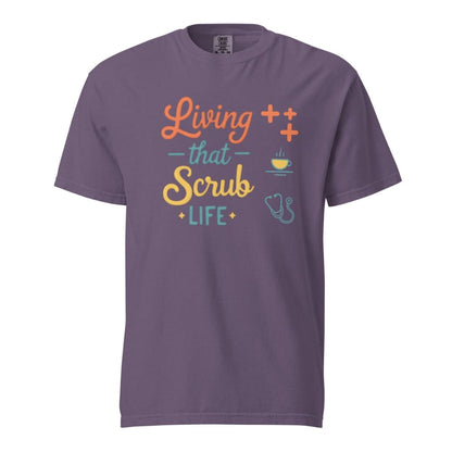 “Living That Scrub Life” colorful text printed on a garment-dyed cotton t-shirt for nurses and healthcare professionals