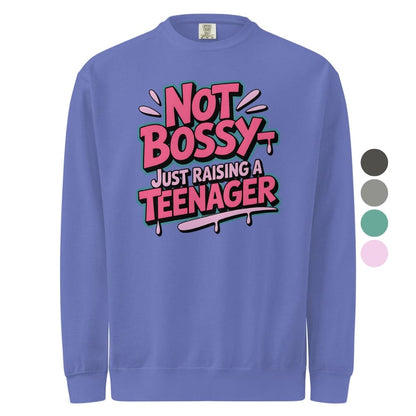 Purple sweatshirt with 'Not Bossy Just Raising a Teenager' text on a white background