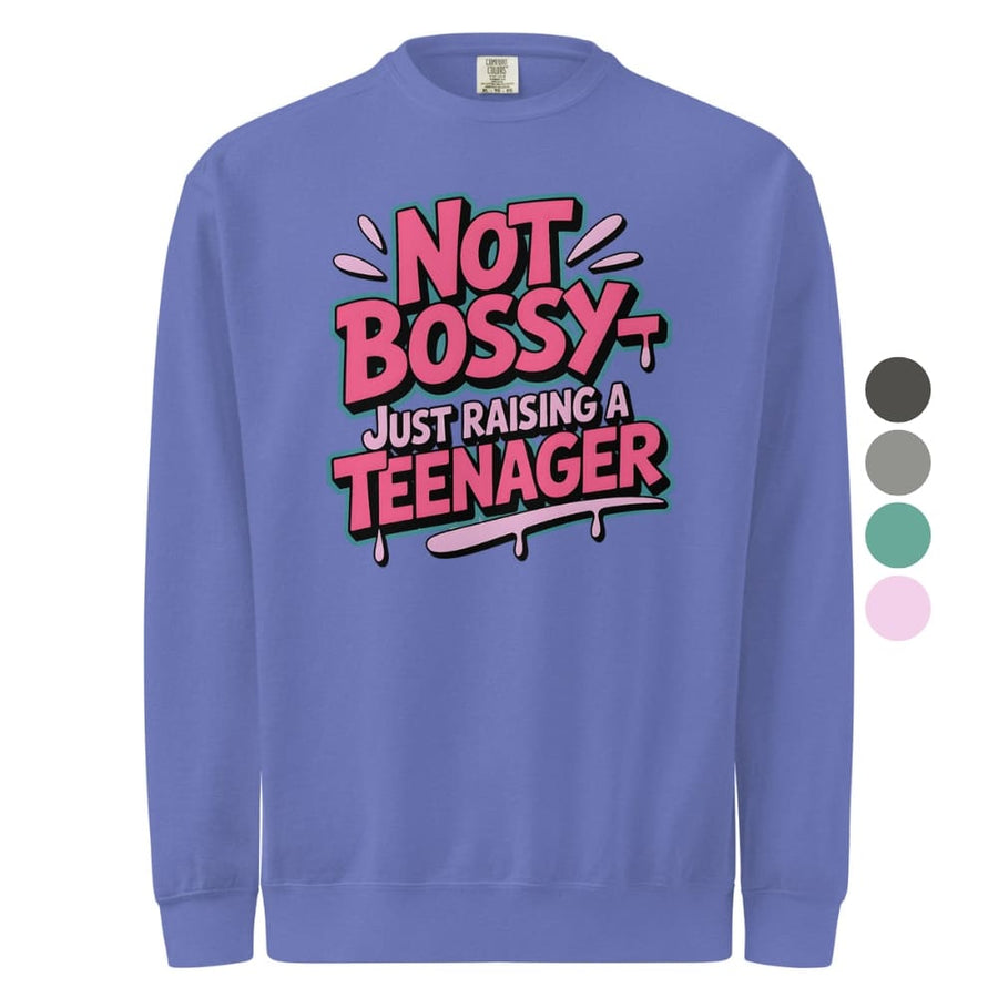 Purple sweatshirt with 'Not Bossy Just Raising a Teenager' text on a white background