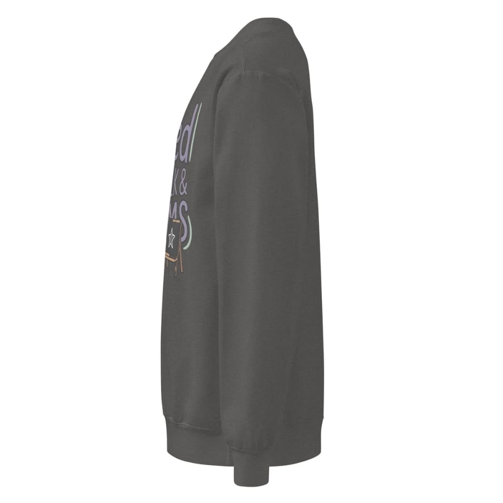 Fueled by Chalk & Dreams printed design on a vintage-style garment-dyed sweatshirt with chalkboard illustration – soft fleece ideal for teachers