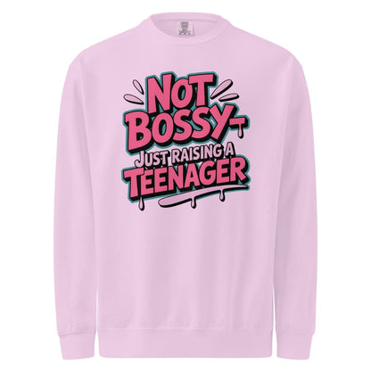 Pink sweatshirt with 'Not Bossy Just Raising a Teenager' text on a white background