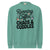 Teal sweatshirt with text 'Running on Coffee, Chaos & Cuddles' on a white background