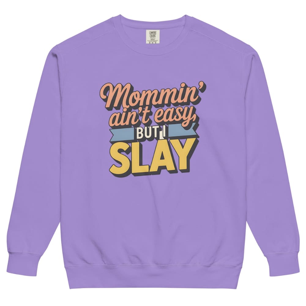 “Mommin' Ain’t Easy But I Slay” retro-style DTG printed design in peach, blue, and yellow on vintage garment-dyed fleece sweatshirt