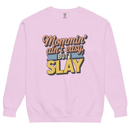 “Mommin' Ain’t Easy But I Slay” retro-style DTG printed design in peach, blue, and yellow on vintage garment-dyed fleece sweatshirt