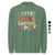Green sweatshirt with colorful text 'COFFEE. CHAOS. CARPOOL. REPEAT.' on a white background.