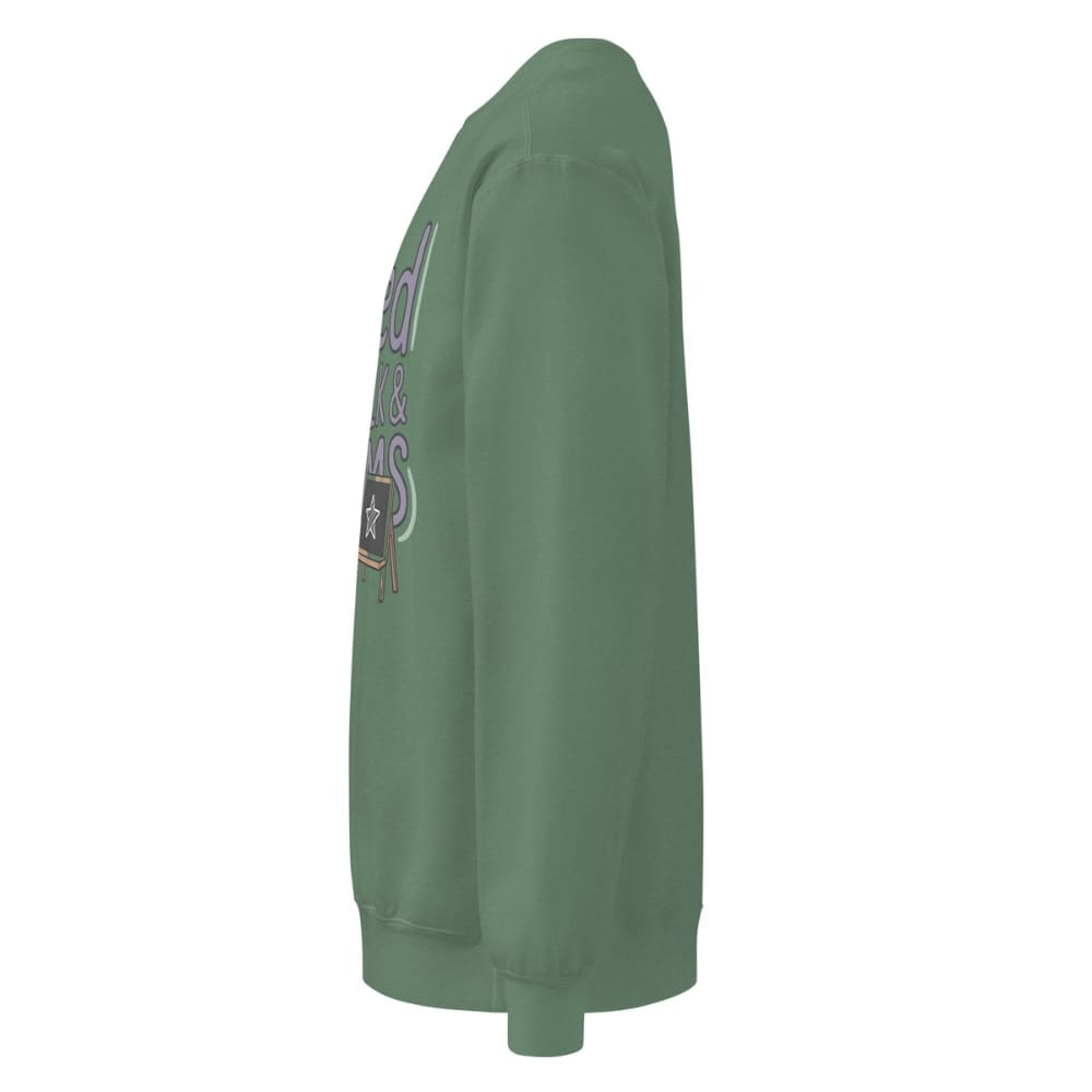 Fueled by Chalk & Dreams printed design on a vintage-style garment-dyed sweatshirt with chalkboard illustration – soft fleece ideal for teachers