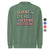Green sweatshirt with colorful text 'FLUENT IN EYE ROLLS & BEDTIME NEGOTIATIONS' on a white background.