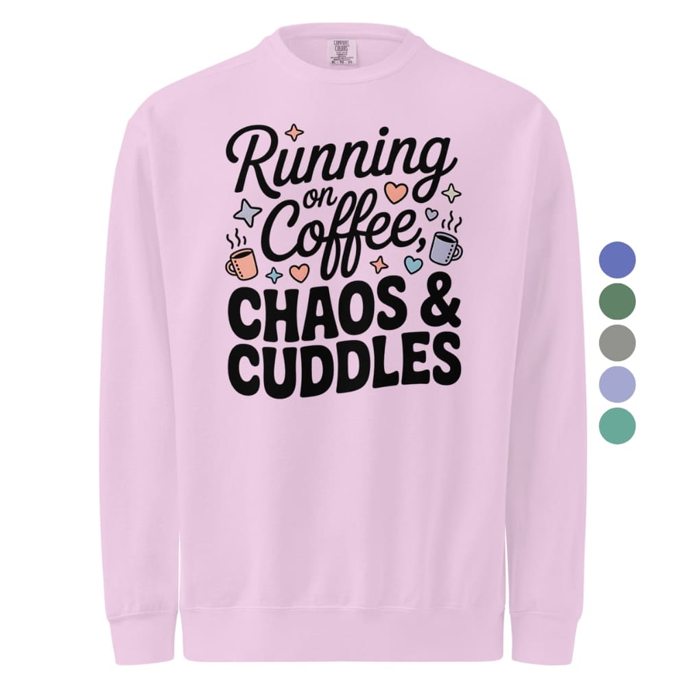 Pink sweatshirt with 'Running on Coffee, Chaos & Cuddles' text and graphics on a white background.