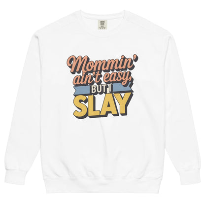 “Mommin' Ain’t Easy But I Slay” retro-style DTG printed design in peach, blue, and yellow on vintage garment-dyed fleece sweatshirt