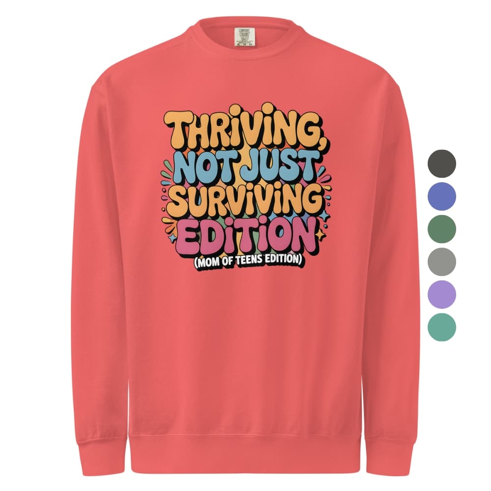 Red sweatshirt with colorful text design on a white background