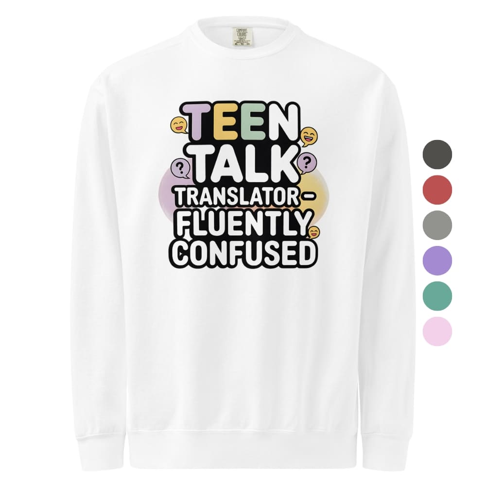 White long-sleeve shirt with colorful text 'TEEN TALK TRANSLATOR FLUENTLY CONFUSED' on a white background.