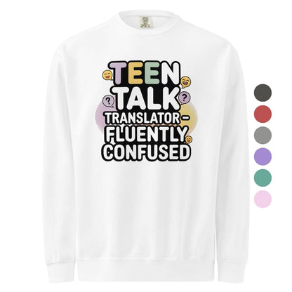 White long-sleeve shirt with colorful text 'TEEN TALK TRANSLATOR FLUENTLY CONFUSED' on a white background.