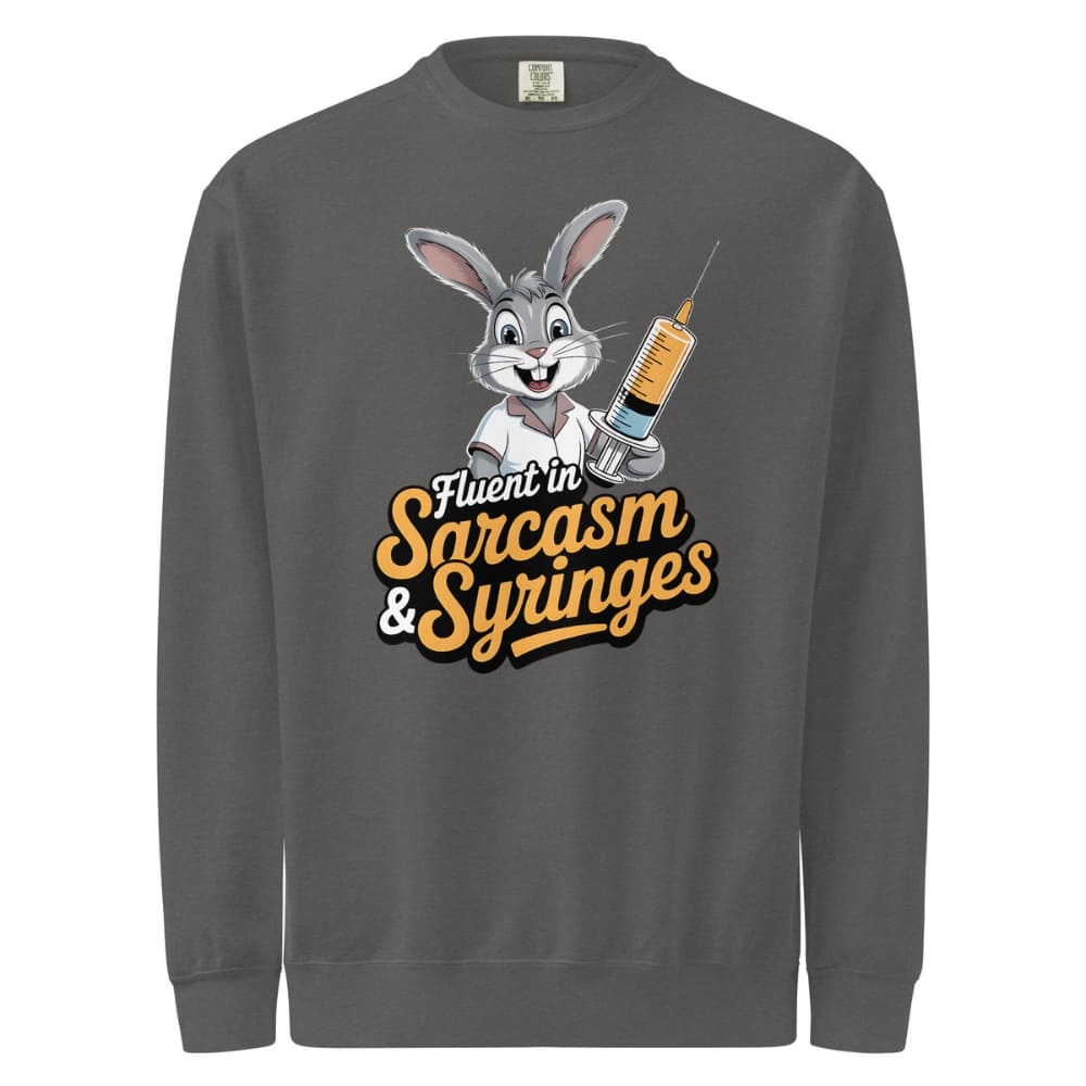 Gray sweatshirt with cartoon character holding a syringe and text 'Fluent in Sarcasm & Syringes' on a white background
