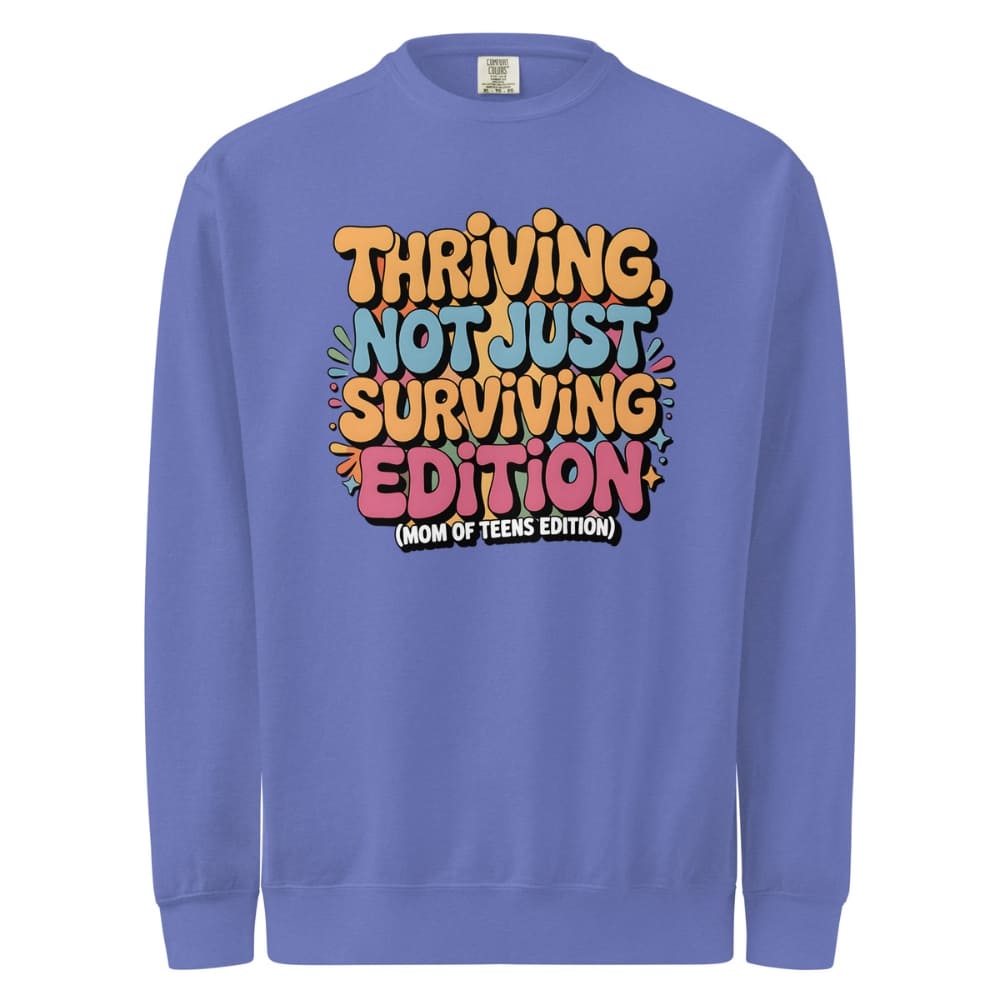 Purple sweatshirt with colorful text design on a white background