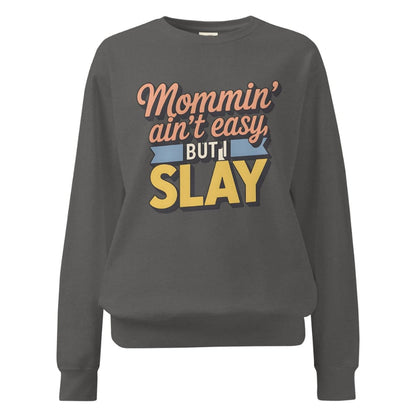 “Mommin' Ain’t Easy But I Slay” retro-style DTG printed design in peach, blue, and yellow on vintage garment-dyed fleece sweatshirt