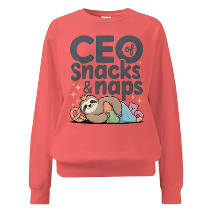 "CEO of Snacks & Naps" printed sweatshirt featuring a sloth in a crown surrounded by pretzels and plushies on vintage-washed cotton fleece