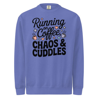 Blue sweatshirt with text 'Running on Coffee, Chaos & Cuddles' on a white background