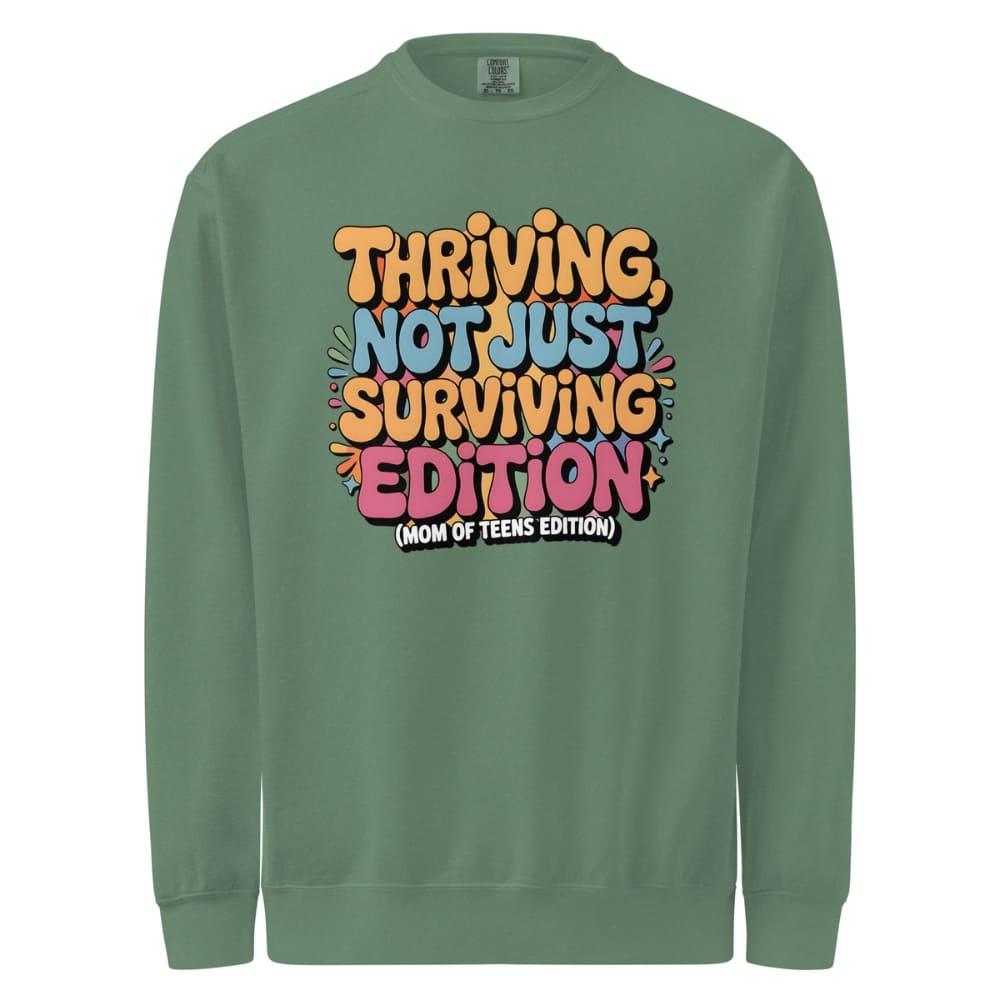 Green sweatshirt with colorful text design on a white background