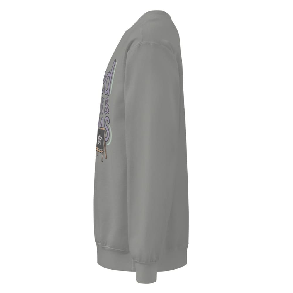 Fueled by Chalk & Dreams printed design on a vintage-style garment-dyed sweatshirt with chalkboard illustration – soft fleece ideal for teachers