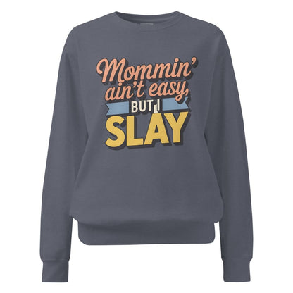 “Mommin' Ain’t Easy But I Slay” retro-style DTG printed design in peach, blue, and yellow on vintage garment-dyed fleece sweatshirt