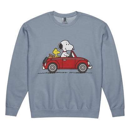 Blue sweatshirt with a graphic of Snoopy and Woodstock in a red car on a white background