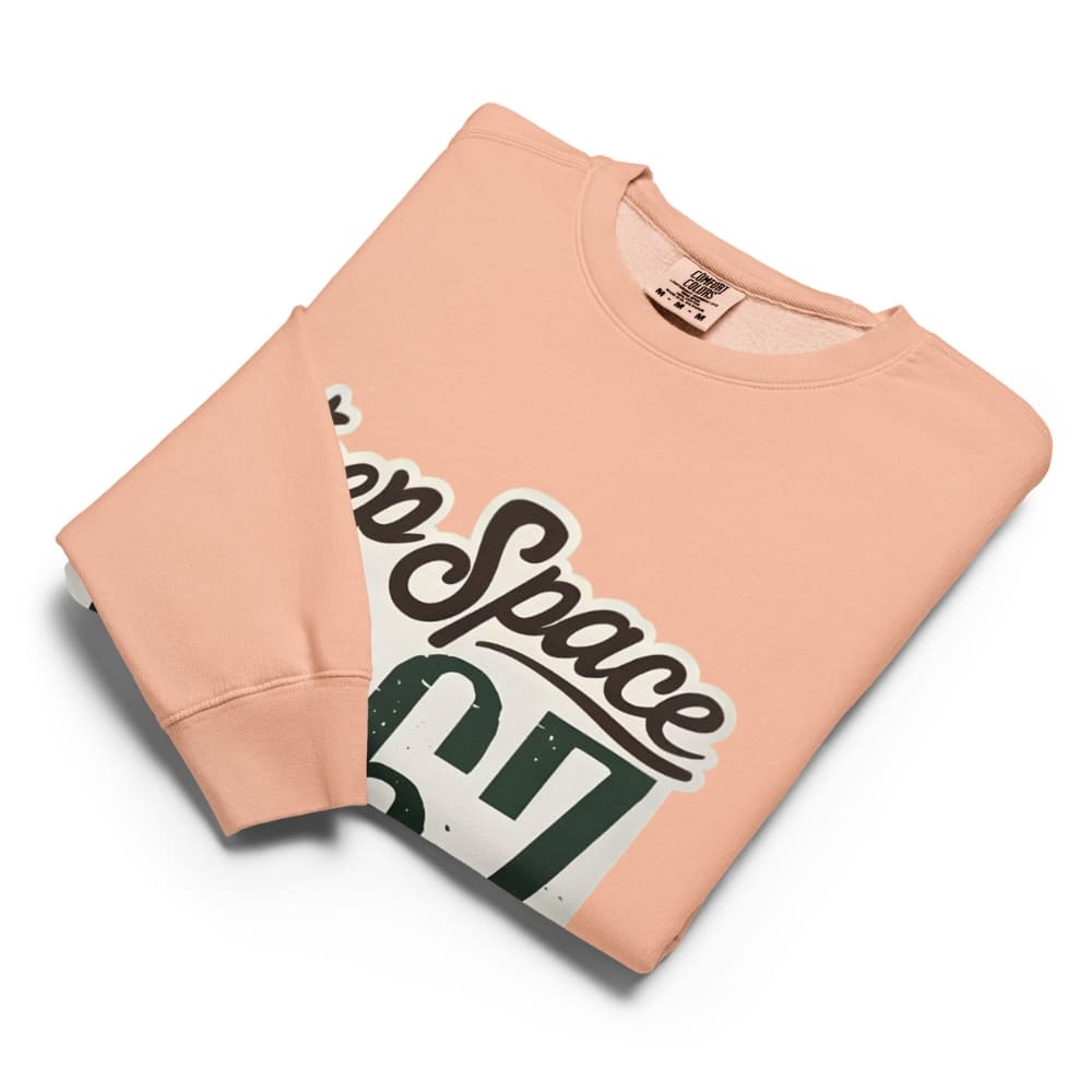 Peach-colored sweatshirt with 'Keep Space' graphic design on a white background