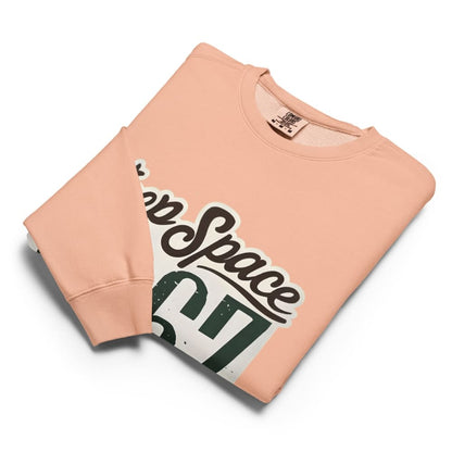 Peach-colored sweatshirt with 'Keep Space' graphic design on a white background
