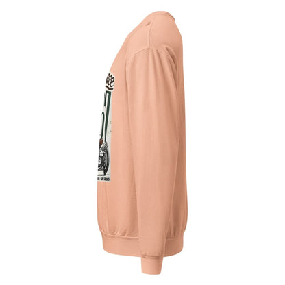 Peach-colored sweatshirt with a graphic on the sleeve against a white background