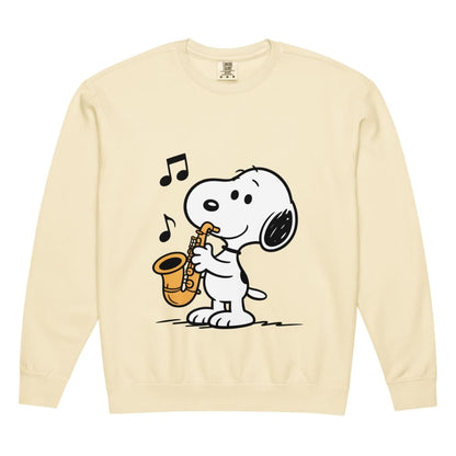 Beige sweatshirt with a cartoon dog playing a saxophone on a white background