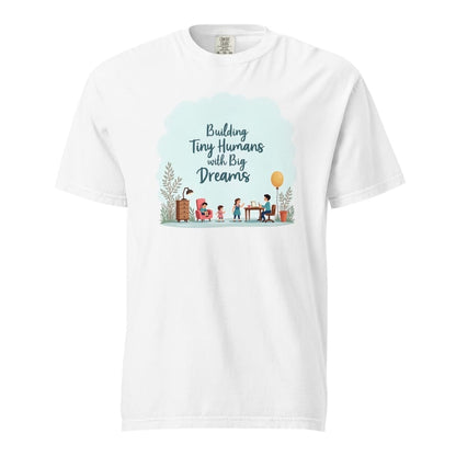 Illustrated t-shirt design with the quote "Building Tiny Humans with Big Dreams" surrounded by a family parenting scene
