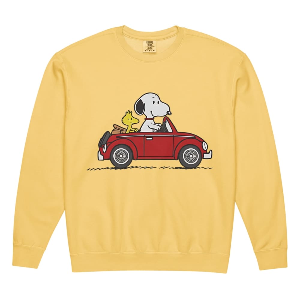 Yellow sweatshirt with a cartoon design of Snoopy and Woodstock in a car on a white background