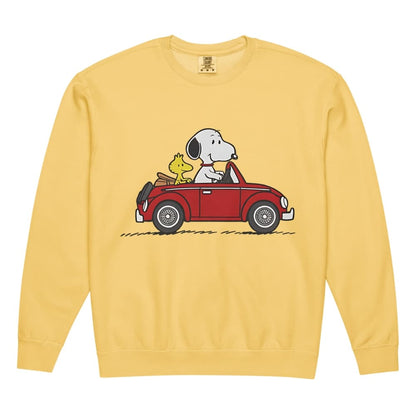 Yellow sweatshirt with a cartoon design of Snoopy and Woodstock in a car on a white background