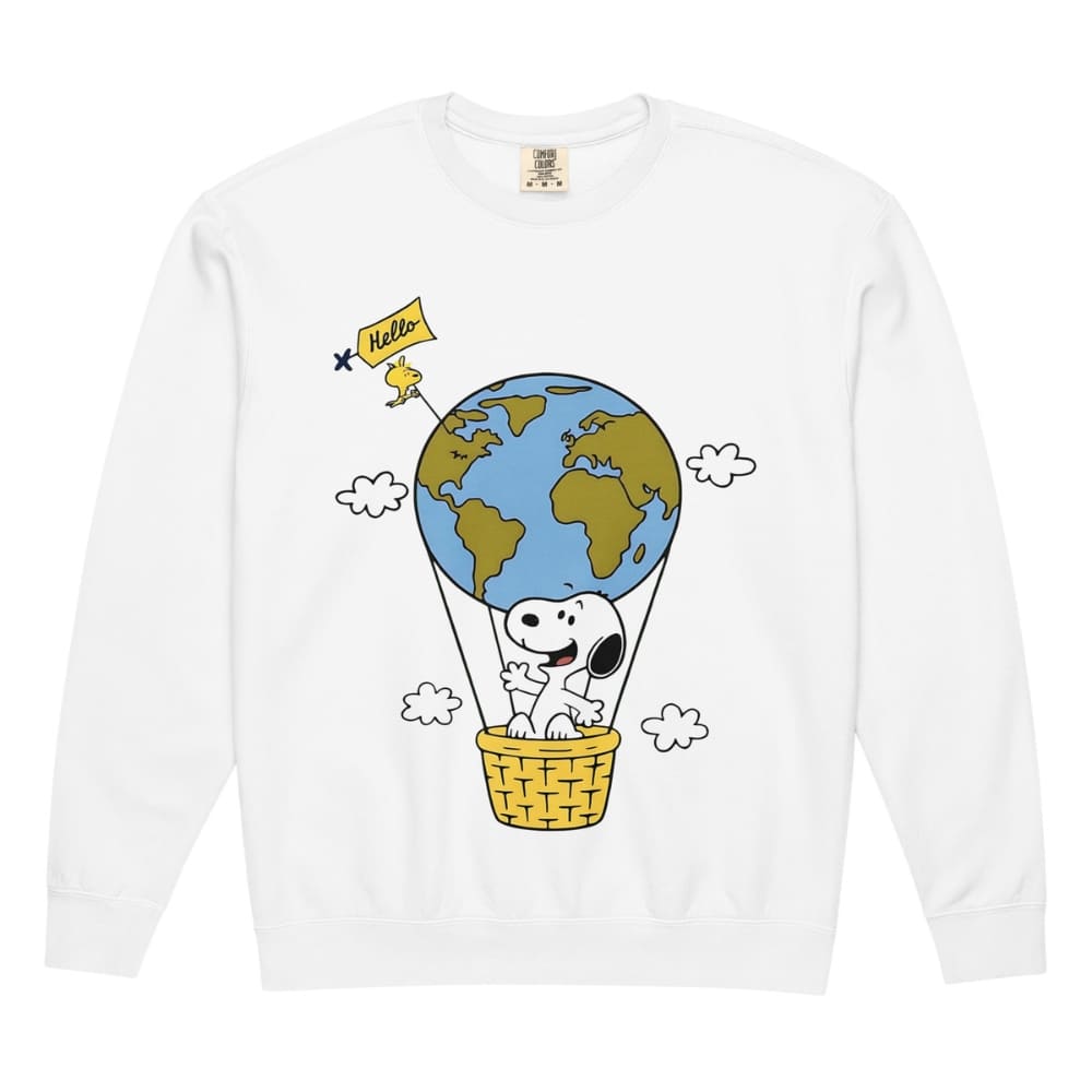 White long-sleeve shirt with a cartoon design of a dog in a hot air balloon with the Earth, on a white background.