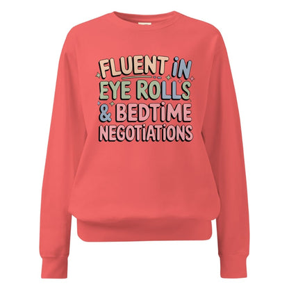 Coral sweatshirt with colorful text on a white background