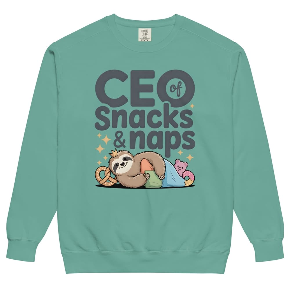 "CEO of Snacks & Naps" printed sweatshirt featuring a sloth in a crown surrounded by pretzels and plushies on vintage-washed cotton fleece