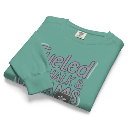 Fueled by Chalk & Dreams printed design on a vintage-style garment-dyed sweatshirt with chalkboard illustration – soft fleece ideal for teachers