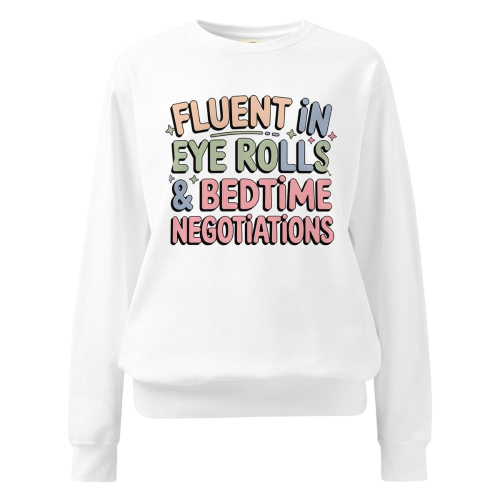 White sweatshirt with colorful text 'FLUENT IN EYE ROLLS & BEDTIME NEGOTIATIONS' on a white background