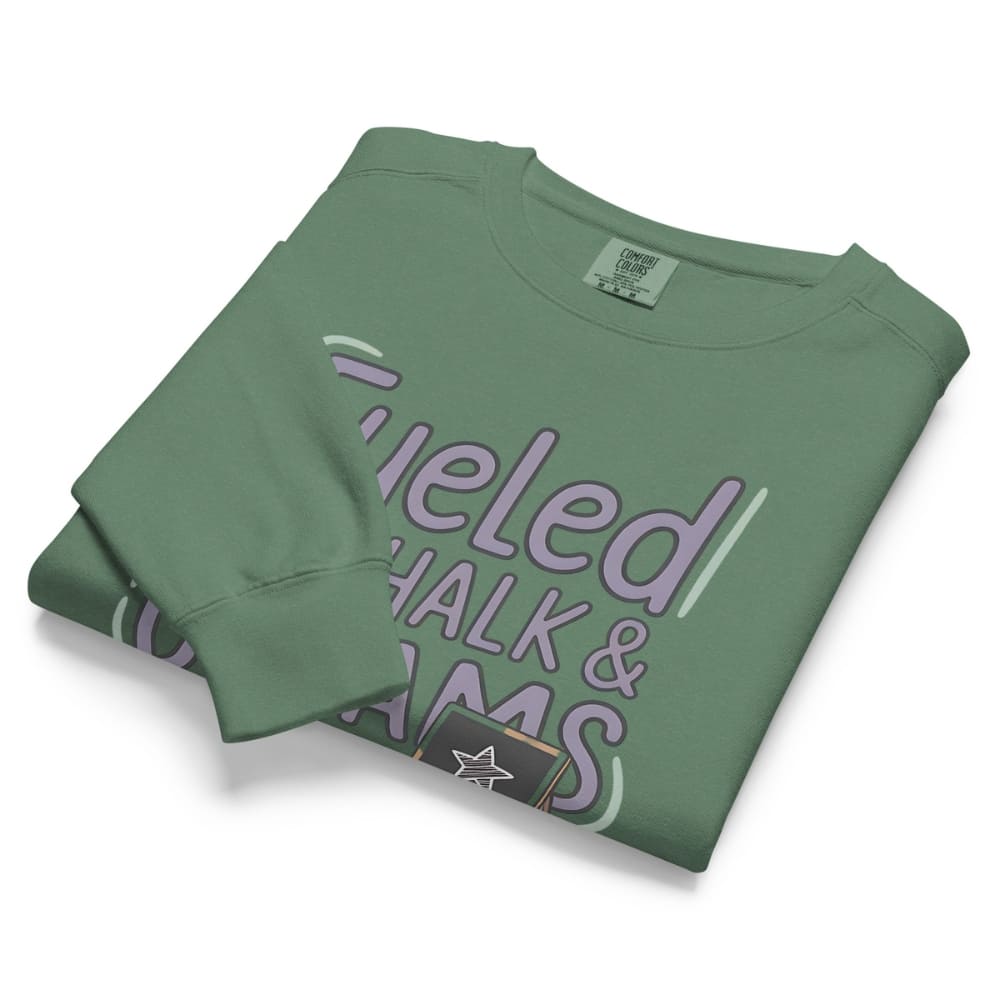 Fueled by Chalk & Dreams printed design on a vintage-style garment-dyed sweatshirt with chalkboard illustration – soft fleece ideal for teachers