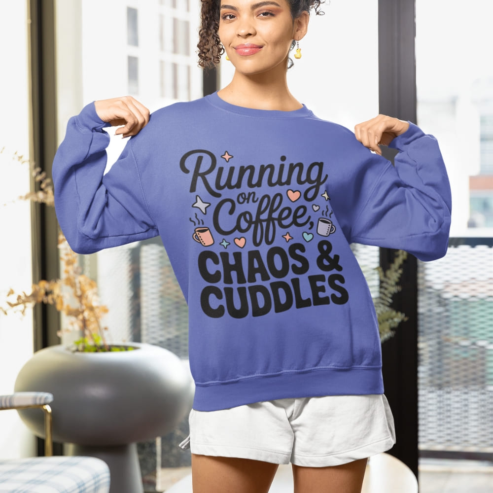 Woman wearing a blue sweatshirt with text in an indoor setting
