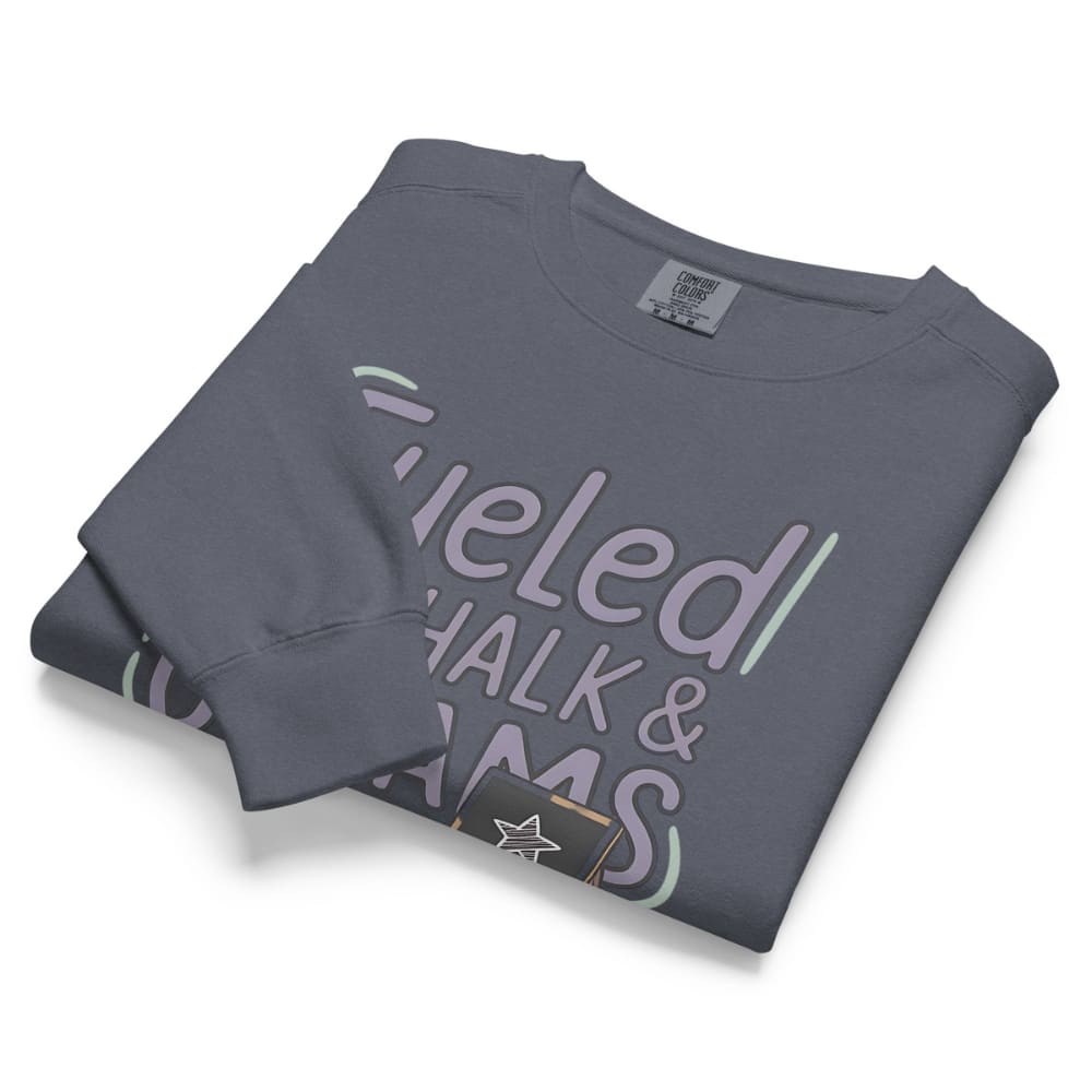 Fueled by Chalk & Dreams printed design on a vintage-style garment-dyed sweatshirt with chalkboard illustration – soft fleece ideal for teachers