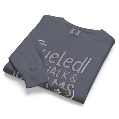 Fueled by Chalk & Dreams printed design on a vintage-style garment-dyed sweatshirt with chalkboard illustration – soft fleece ideal for teachers