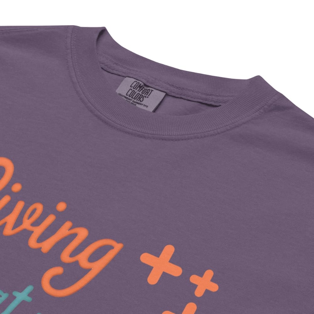 “Living That Scrub Life” colorful text printed on a garment-dyed cotton t-shirt for nurses and healthcare professionals