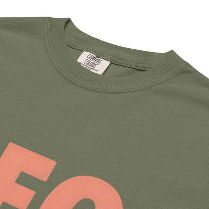 CEO of the Chaos” printed on a heavyweight cotton t-shirt in soft pastel ink, laid flat with a minimal lifestyle background.