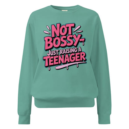 Teal sweatshirt with pink and white text on a white background