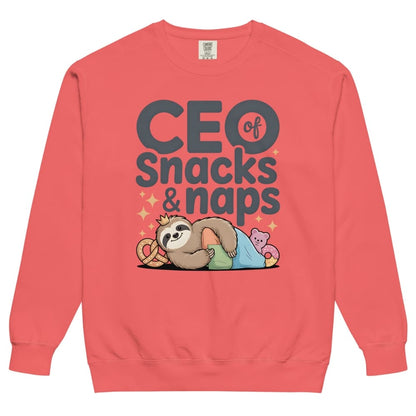 "CEO of Snacks & Naps" printed sweatshirt featuring a sloth in a crown surrounded by pretzels and plushies on vintage-washed cotton fleece