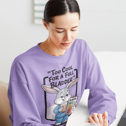 Person wearing a purple sweatshirt with a graphic design of a rabbit and text.