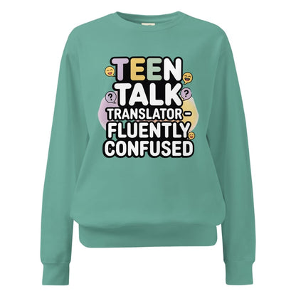 Teal sweatshirt with text 'TEEN TALK TRANSLATOR - FLUENTLY CONFUSED' on a white background